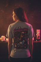 Woman modeling an It's a Beautiful Chaos graphic tee from the Graphic Tees collection